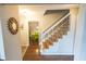 Elegant staircase with a patterned riser and wrought iron railing at 8139 Hi Vu Dr, Indianapolis, IN 46227