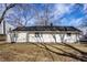 The rear exterior of the home, featuring a well-maintained yard at 8815 Frontenac Rd, Indianapolis, IN 46226