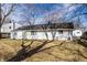 A view of the back exterior of the home with a fenced-in yard at 8815 Frontenac Rd, Indianapolis, IN 46226