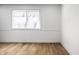 Bright bedroom features light, neutral walls and attractive hardwood flooring at 8815 Frontenac Rd, Indianapolis, IN 46226