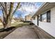Charming single-story home with white siding, black door, and a concrete walkway at 8815 Frontenac Rd, Indianapolis, IN 46226