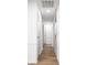 Long hallway with multiple doorways and attractive hardwood-style flooring, lots of possibilities at 8815 Frontenac Rd, Indianapolis, IN 46226