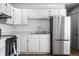 Well-equipped kitchen featuring white cabinets, stainless steel appliances, and ample counter space at 8815 Frontenac Rd, Indianapolis, IN 46226