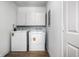 A laundry room featuring a washer, dryer, and overhead cabinets at 8815 Frontenac Rd, Indianapolis, IN 46226
