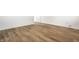 Bright living room with wood-look flooring and neutral walls at 8815 Frontenac Rd, Indianapolis, IN 46226