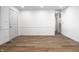 Spacious living room featuring wood-look vinyl flooring and a clean, bright interior with neutral paint at 8815 Frontenac Rd, Indianapolis, IN 46226