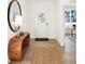 Bright entryway featuring wood floors, a console table, and a large mirror at 9113 Rockville Pl, McCordsville, IN 46055