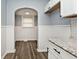 Small dining area with hardwood floors and an arched entryway at 1058 N Holmes Ave, Indianapolis, IN 46222