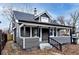 Gray house with white trim, front porch, and landscaping at 1058 N Holmes Ave, Indianapolis, IN 46222