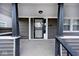 Front door entry with security door and porch at 1058 N Holmes Ave, Indianapolis, IN 46222