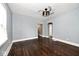 Empty living room with hardwood floors and ceiling fan at 1058 N Holmes Ave, Indianapolis, IN 46222