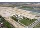 An aerial view shows the planned housing development with ponds and green spaces in a rural setting at 1132 Fleming Dr, Greenfield, IN 46140