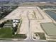An aerial view displays the layout of future homes with ponds and road network established in the community at 1132 Fleming Dr, Greenfield, IN 46140