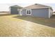 Home's backyard showcases durable siding, a well-maintained lawn, and new construction at 1132 Fleming Dr, Greenfield, IN 46140