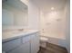 Bathroom featuring modern vanity, sleek fixtures, and a shower-tub combo at 1132 Fleming Dr, Greenfield, IN 46140