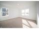 Bright and airy bedroom featuring neutral carpeting and large windows offering ample natural light at 1132 Fleming Dr, Greenfield, IN 46140