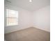 Bright bedroom features neutral carpeting and a large window at 1132 Fleming Dr, Greenfield, IN 46140
