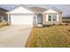 Charming single-story home featuring a two-car garage, brick accents, and well-maintained landscaping at 1132 Fleming Dr, Greenfield, IN 46140