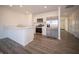 Bright kitchen with stainless steel appliances, quartz countertops, and wood-look flooring at 1132 Fleming Dr, Greenfield, IN 46140