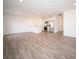 Open concept living area showcasing recessed lights, wood-look floors, and a modern kitchen at 1132 Fleming Dr, Greenfield, IN 46140