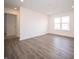 A naturally lit living room featuring recessed lights and wood-look flooring at 1132 Fleming Dr, Greenfield, IN 46140