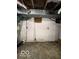 Unfinished basement area with exposed pipes and wiring at 1154 N Belleview Pl, Indianapolis, IN 46222