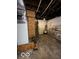 Unfinished basement with water heater and exposed utilities at 1154 N Belleview Pl, Indianapolis, IN 46222