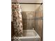 Clean bathroom with shower/tub and tile surround at 1154 N Belleview Pl, Indianapolis, IN 46222