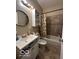 Updated bathroom, featuring a bathtub, toilet and vanity at 1154 N Belleview Pl, Indianapolis, IN 46222