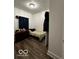 Bedroom with double bed and dark wood-look flooring at 1154 N Belleview Pl, Indianapolis, IN 46222
