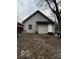 Rear view of the house, showing a small addition and yard at 1154 N Belleview Pl, Indianapolis, IN 46222