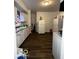 White kitchen cabinets, dark floors, and appliances at 1154 N Belleview Pl, Indianapolis, IN 46222