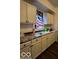 White kitchen cabinets and marble-look countertops at 1154 N Belleview Pl, Indianapolis, IN 46222