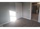 Bedroom with neutral walls, carpeting, and a view into the kitchen at 1510 Josephine St, Martinsville, IN 46151