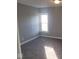 Neutral bedroom with newer carpet and a large window for ample light at 1510 Josephine St, Martinsville, IN 46151