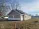 Exterior view of this house from the side, with gray siding and freshly cut grass at 1510 Josephine St, Martinsville, IN 46151