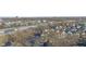 Wide aerial view of homes near a park, with highway access, providing a snapshot of community and connectivity at 1515 Ringgold Ave, Indianapolis, IN 46203