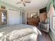 This charming bedroom features wood dresser, ceiling fan, and natural light from the window at 1515 Ringgold Ave, Indianapolis, IN 46203