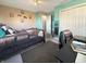 Bright bedroom with a comfortable bed, a functional desk area, and a mirrored accent piece, offering a blend of relaxation and utility at 1515 Ringgold Ave, Indianapolis, IN 46203