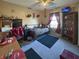 Cozy bedroom featuring a bed, desk, shelving and a TV mounted in the corner at 1515 Ringgold Ave, Indianapolis, IN 46203