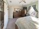 This charming bedroom features wood dresser, ceiling fan, and natural light from the window at 1515 Ringgold Ave, Indianapolis, IN 46203