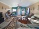 Inviting living room featuring hardwood floors, a ceiling fan, neutral paint, and ample space for relaxing and entertaining at 1515 Ringgold Ave, Indianapolis, IN 46203