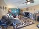 Inviting living room featuring hardwood floors, a ceiling fan, neutral paint, and ample space for relaxing and entertaining at 1515 Ringgold Ave, Indianapolis, IN 46203
