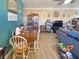 Open-concept living room featuring hardwood floors, a cozy dining area and neutral paint, perfect for Gathering living at 1515 Ringgold Ave, Indianapolis, IN 46203