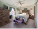 Comfortable bedroom with wooden bed frame, furniture, and natural light from window at 1515 Ringgold Ave, Indianapolis, IN 46203