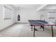Basement with ping pong table, punching bag, and carpeted floors at 16012 Forewood Ln, Fishers, IN 46037
