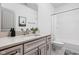 Bathroom with double sink, light gray cabinets, shower over tub, and modern decor at 16012 Forewood Ln, Fishers, IN 46037