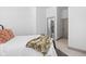 Cozy bedroom with soft bedding and a glimpse of an ensuite bathroom at 16012 Forewood Ln, Fishers, IN 46037