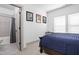 Bedroom with blue comforter, sports memorabilia, and an ensuite bathroom at 16012 Forewood Ln, Fishers, IN 46037
