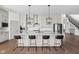 Spacious kitchen with a large island, granite countertops, stainless steel appliances, and modern lighting at 16012 Forewood Ln, Fishers, IN 46037